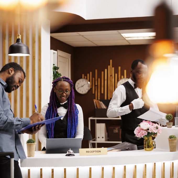 Hotel guest filling up registration form